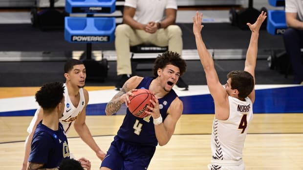 Mar 19, 2021; Indianapolis, Indiana, USA; Georgia Tech Yellow Jackets guard Jordan Usher (4) shoots against Loyola Ramblers guard Braden Norris (4) during the first round of the 2021 NCAA Tournament at Hinkle Fieldhouse. Mandatory Credit: Marc Lebryk-USA TODAY Sports